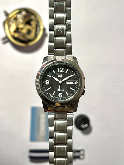 Seiko SNKE63J1 Automatic Men’s Watch – Japan-Made Seiko 5 with Silver Dial & 7S26 Movement